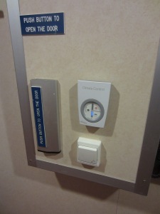 Cabin door opener, lock, and thermostat were placed at a sitting height on the wall.